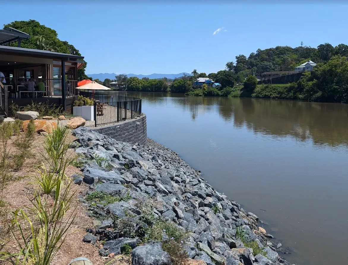 Riverview Hotel deck with palms and river